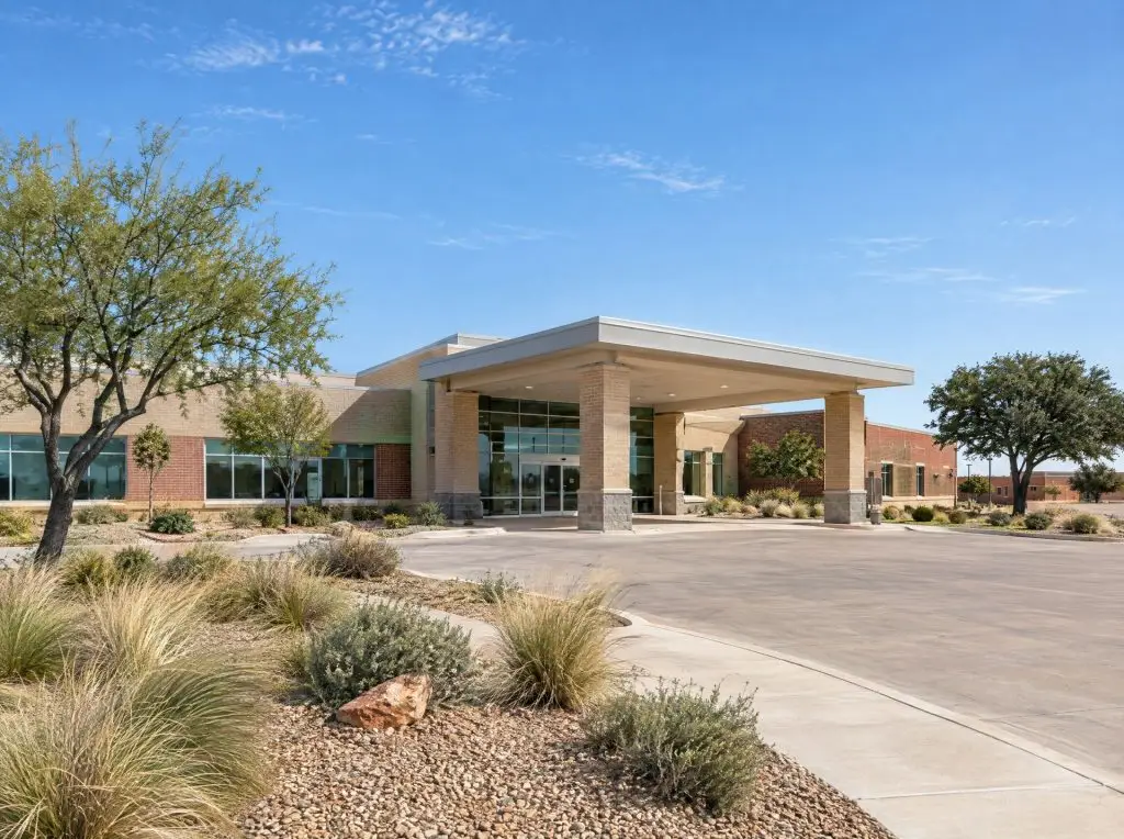 Modern healthcare clinic entrance with landscaped walkway